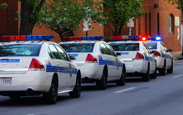 police cars in a row on a street