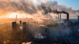 Factory smoke stacks emitting CO2