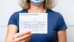 Woman with vaccine card