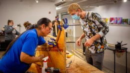 Wayne Valliere and student build a canoe