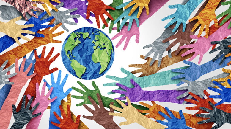 artistic image of several hands of different colors reaching for a globe
