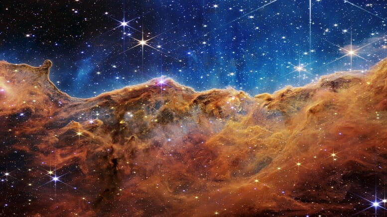 Behind the curtain of dust and gas in these “Cosmic Cliffs” are previously hidden baby stars, now uncovered by the James Webb Space Telescope. This new view provides a rare peek into stars in their earliest, rapid stages of formation. For an individual star, this period only lasts about 50,000 to 100,000 years. Image credit: NASA, ESA, CSA and STScI