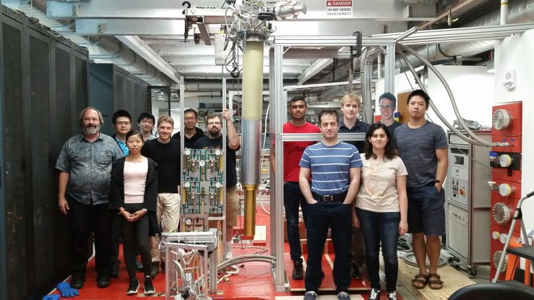 The Gabrielse group standing in the lab