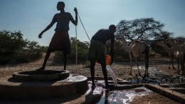 Men extract water from a well at the village of El Gel, near the town of K'elafo, Ethiopia. Getty Images
